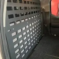The Nissan Frontier Interor Molle Panel is the perfect addition to your adventure truck. It installs easy using the factory seat mounts and can be paired with a full rear seat delete build out or bolted directly to the rear wall. Increase your storage and get more usable space! 